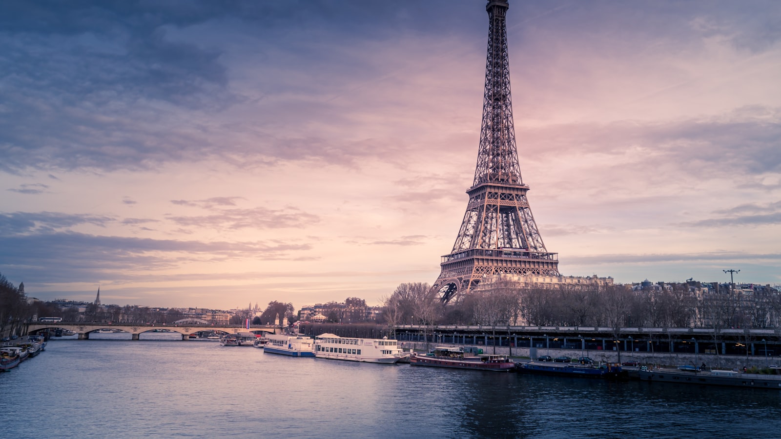 View across a European city rooftop skyline at golden hour